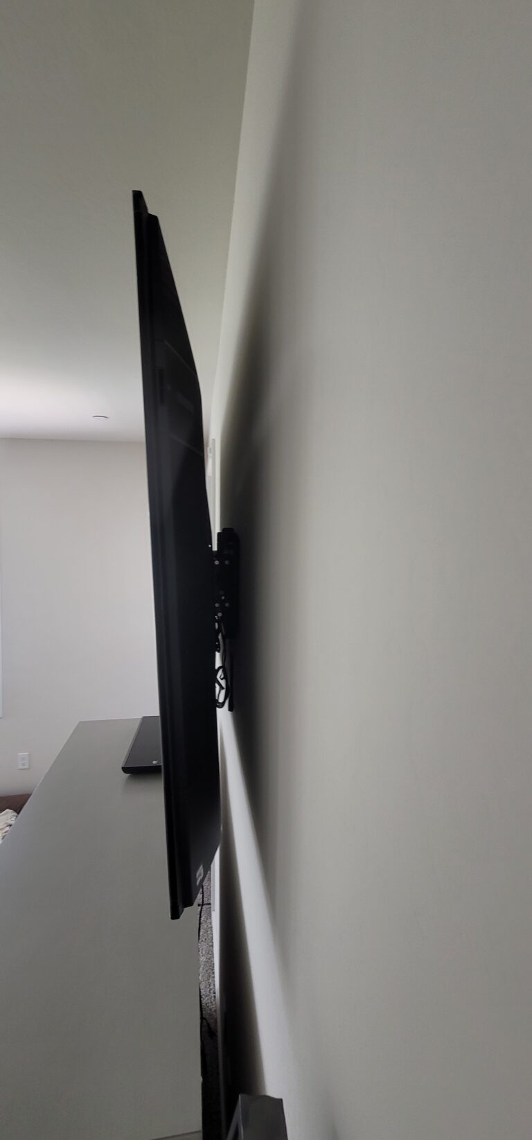 TV wall mounted on a flat bracket. TV Mounting Service.