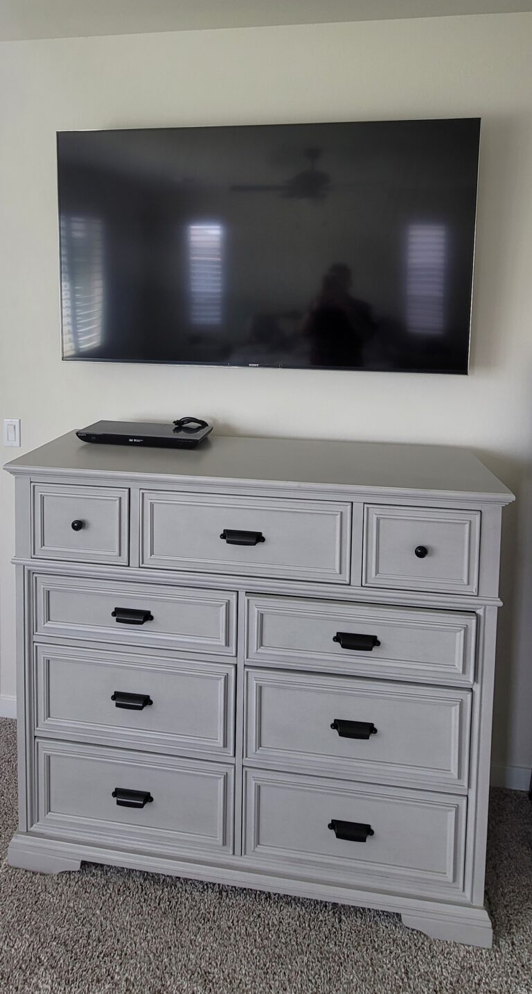 TV wall mounted over customer's master bedroom dresser. TV Mounting Service. Kern County, Bakersfield, CA, USA